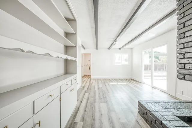 a bathroom with a bathtub and a window