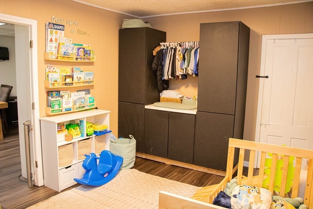 85-87 Slater Street Webster, MA 01570 - Photo 14 of 41 a view of walk in closet with clothes and shoes