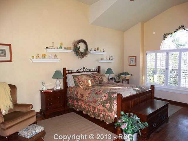 9065 Rutledge Drive Colorado Springs, CO 80920 - Photo 10 of 25 Large master with plantation shutters.
