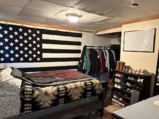 a view of walk in closet with clothes