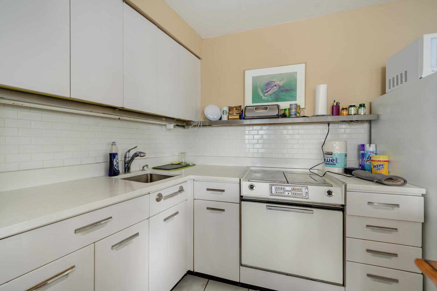 300 North State Street, Unit 4303 Chicago, IL 60654 - Photo 2 of 15 a kitchen with a sink dishwasher and cabinets