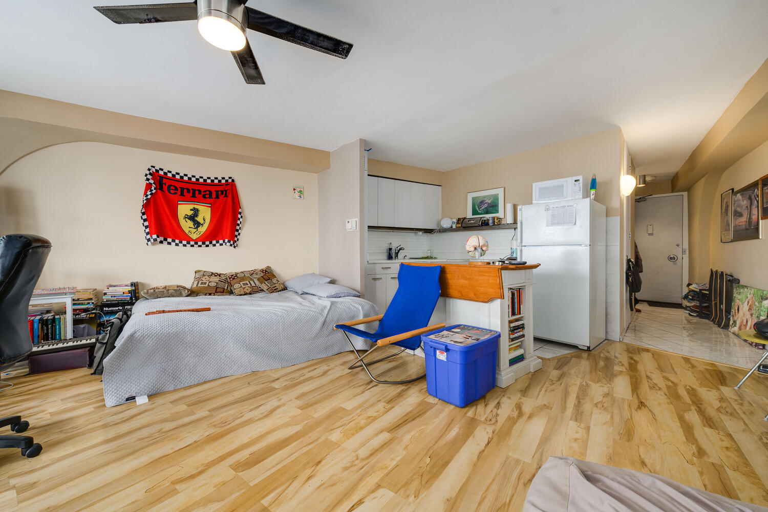 300 North State Street, Unit 4303 Chicago, IL 60654 - Photo 6 of 15 a bedroom with a bed and wooden floor