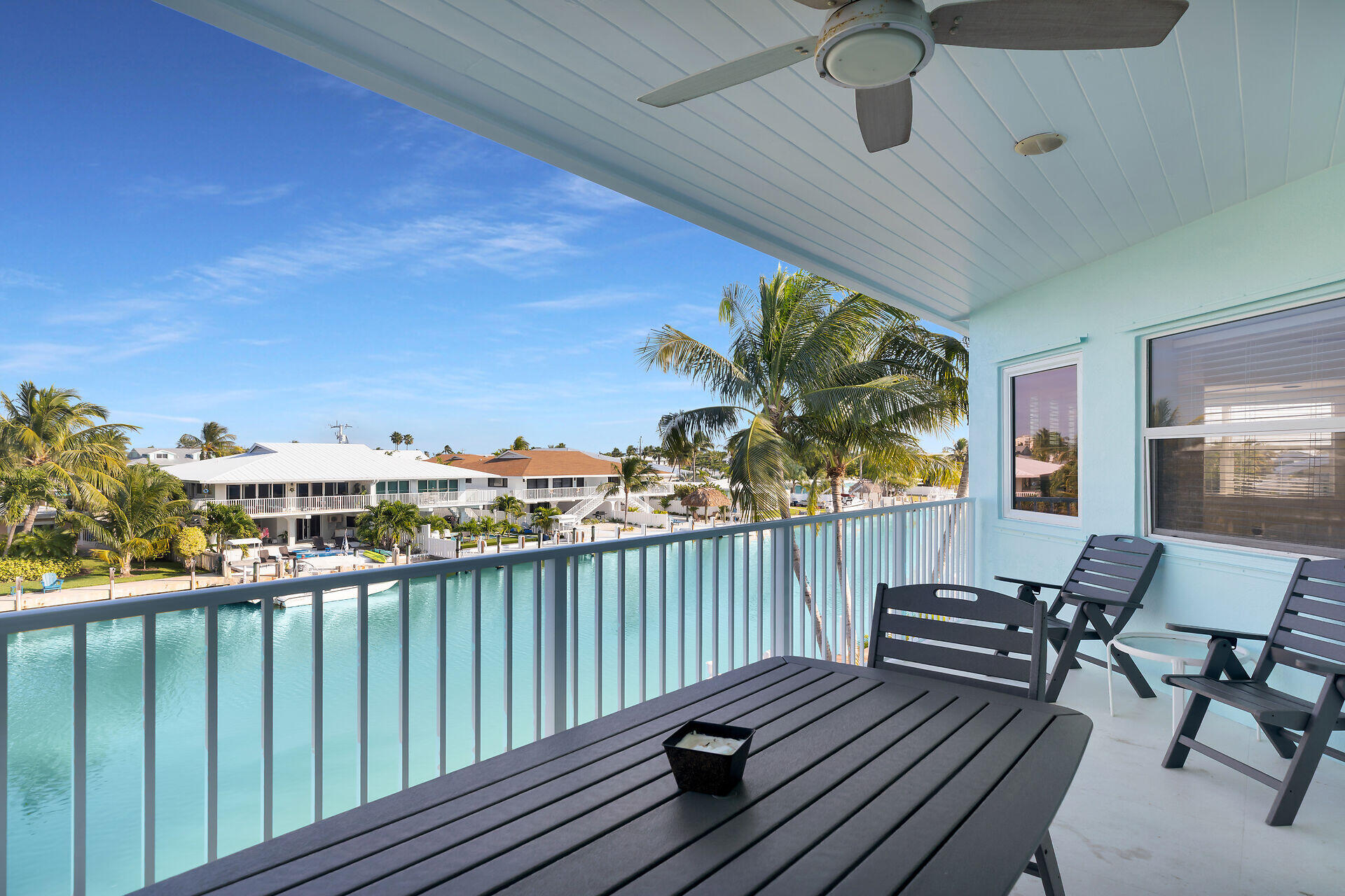 580-590 10th Street Key Colony Beach, FL 33051 - Photo 8 of 75 a view of a balcony with chairs