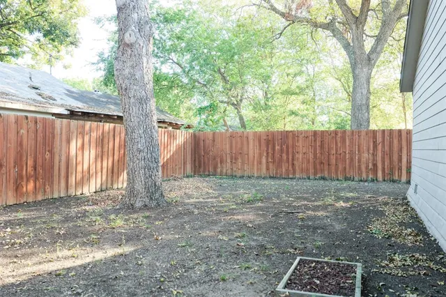 a view of outdoor space with wooden fence
