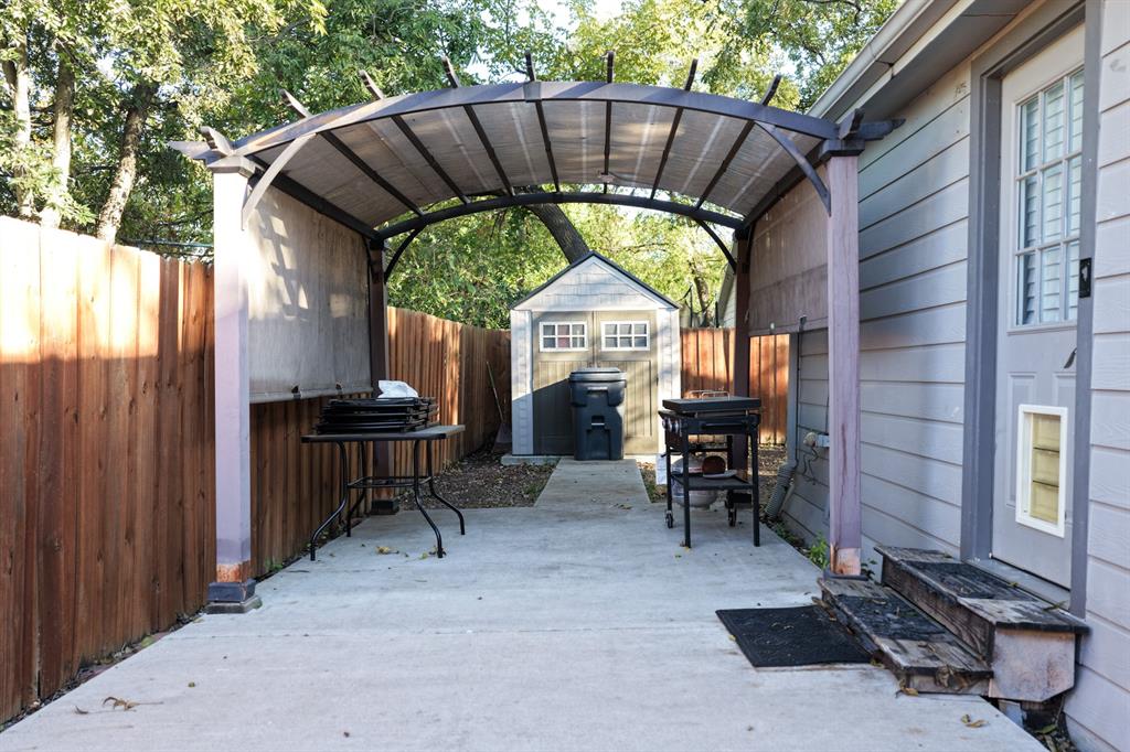 605 East Graham Street McKinney, TX 75069 - Photo 19 of 22 a view of a chairs and table in the patio next to a yard
