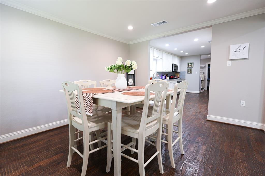 605 East Graham Street McKinney, TX 75069 - Photo 5 of 22 a view of a dining room with furniture and wooden floor