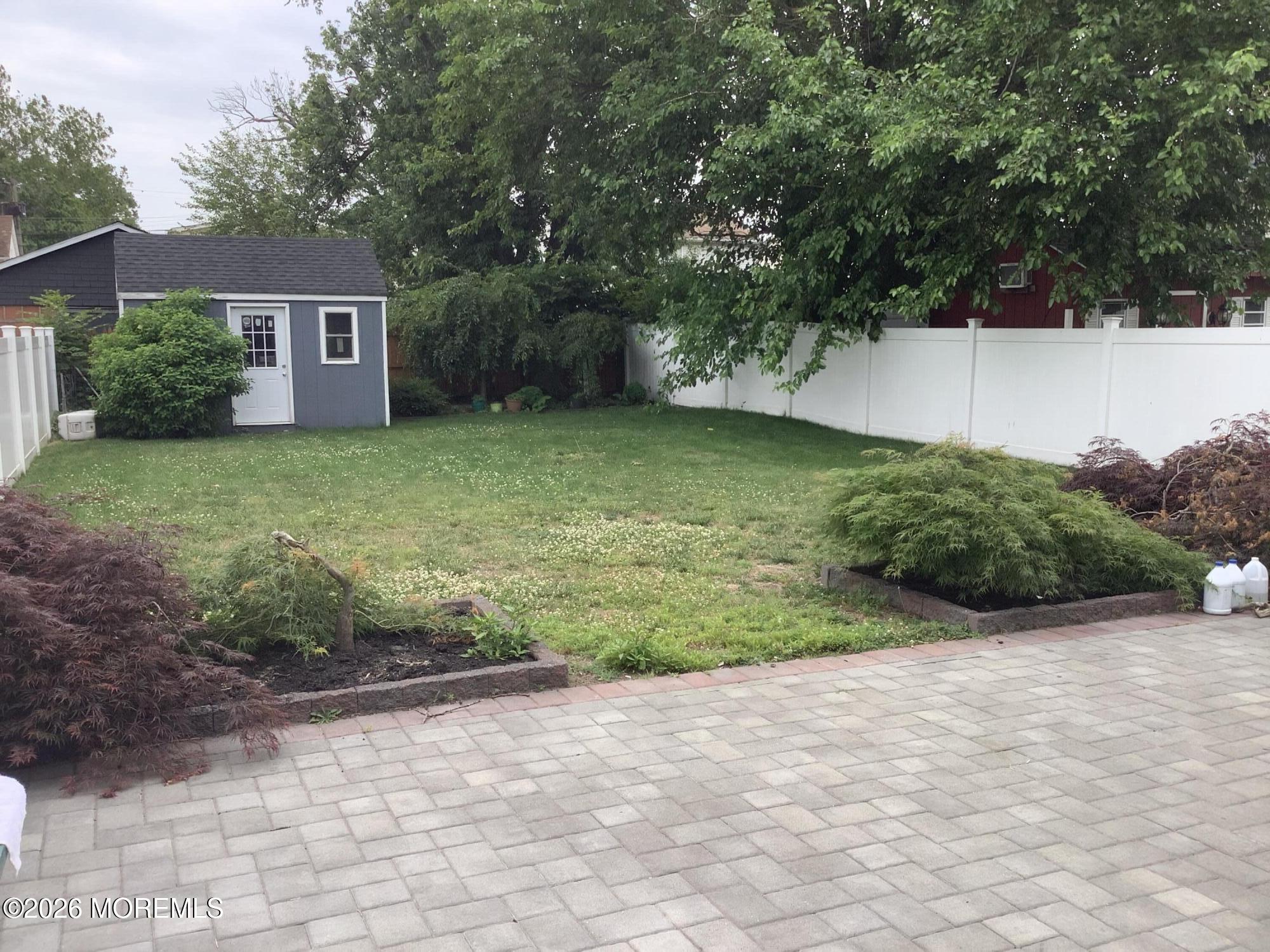 242 1st Street Keyport, NJ 07735 - Photo 6 of 23 a view of a house with a yard and a large tree
