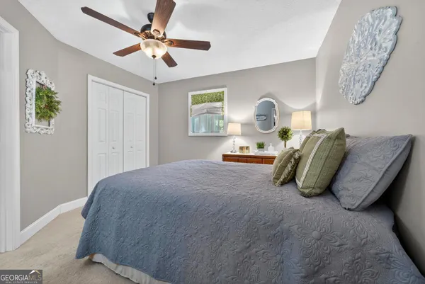 a bedroom with furniture and a book shelf