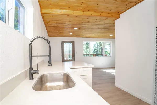 a en suite bathroom with a sink and a window
