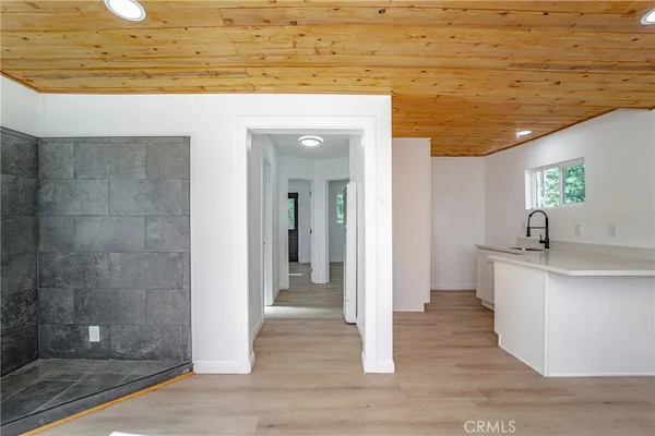 a view of a bathroom with a sink and shower
