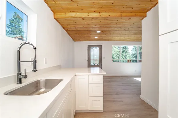 a kitchen with a sink and a window