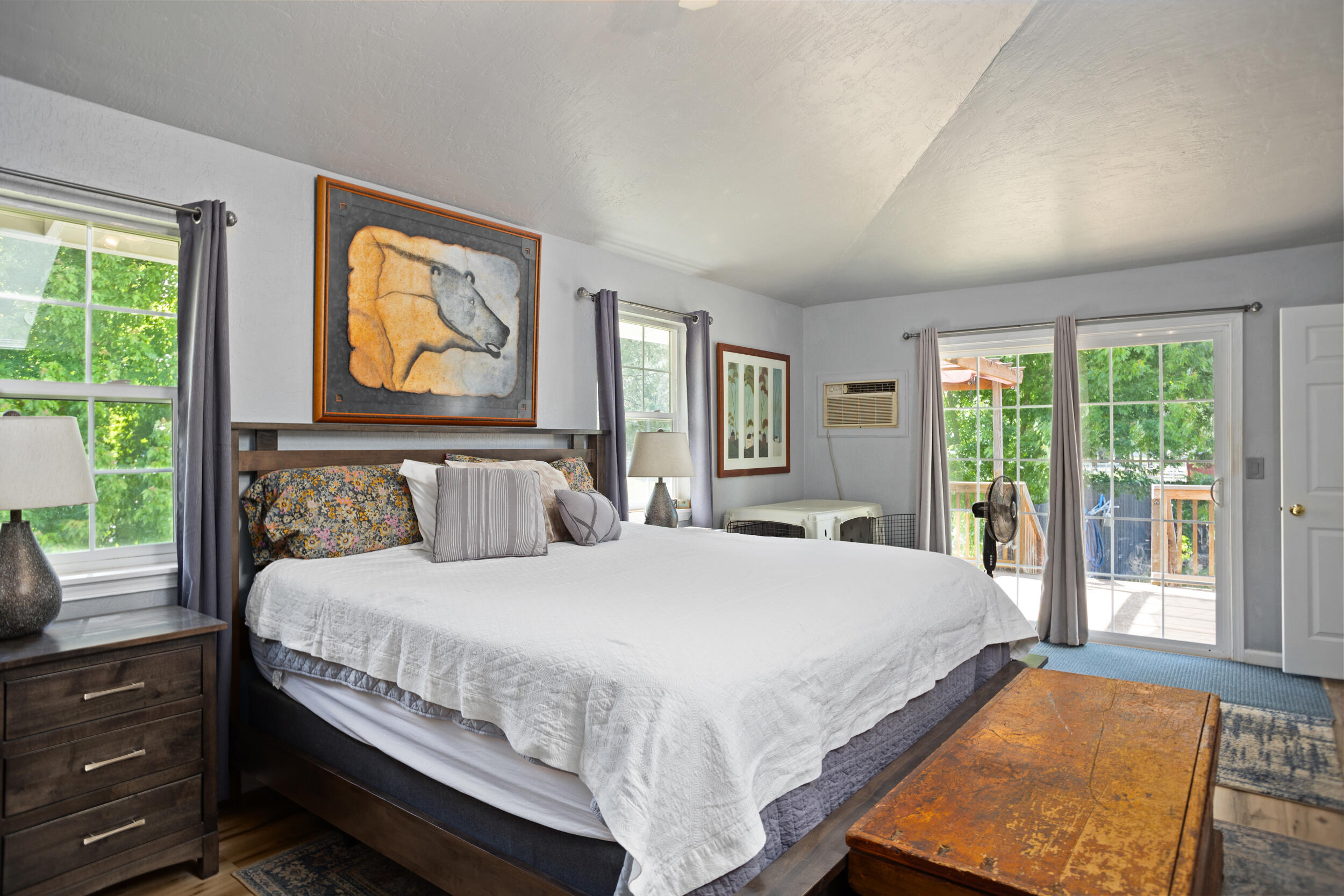255 Queens Branch Road Rogue River, OR 97537 - Photo 16 of 60 a bedroom with a bed and glass window