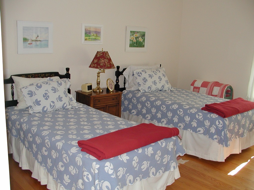 18 Willicutt Road Chesterfield, MA 01012 - Photo 14 of 27 a bed room with a bed and a chair