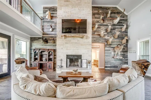 a living room with fireplace furniture and a flat screen tv