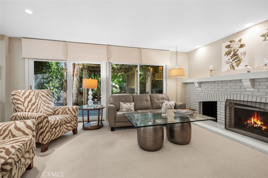 32 Colonial Irvine, CA 92620 - Photo 13 of 33 a living room with furniture and a fireplace