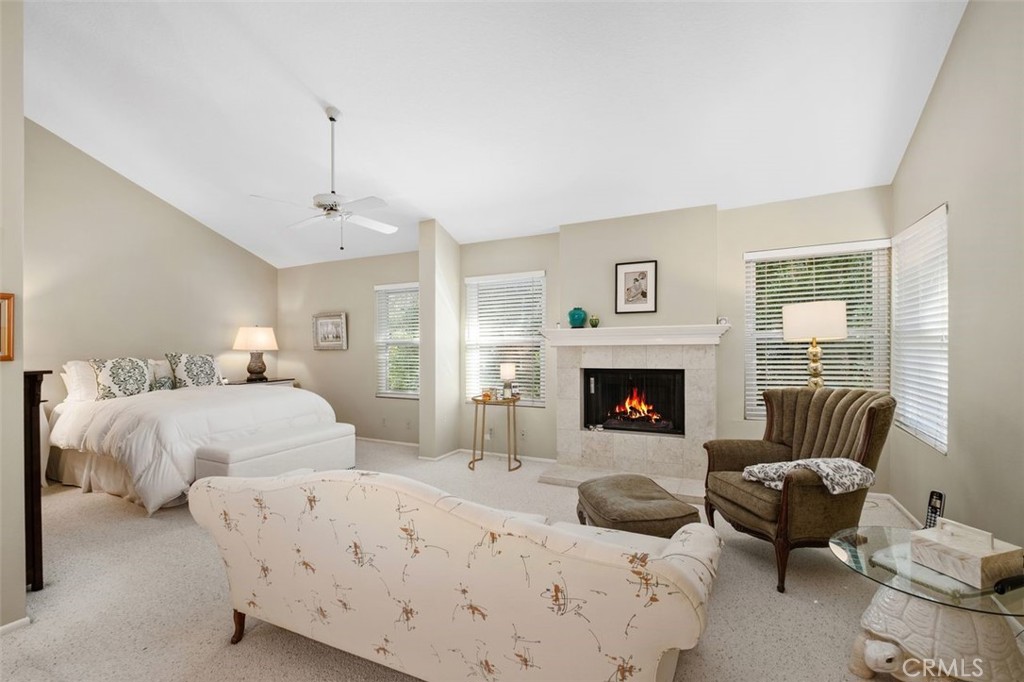 32 Colonial Irvine, CA 92620 - Photo 17 of 33 a bedroom with bed and a fireplace