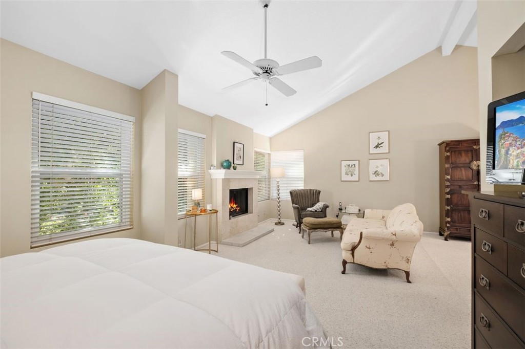 32 Colonial Irvine, CA 92620 - Photo 19 of 33 a bedroom with furniture and a chandelier