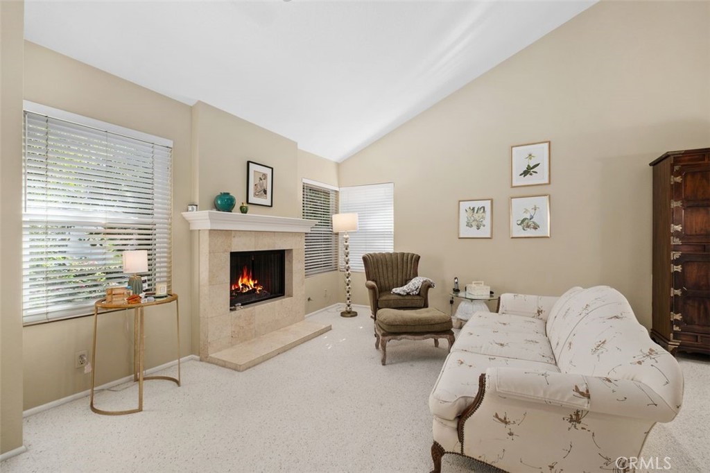 32 Colonial Irvine, CA 92620 - Photo 20 of 33 a living room with furniture and a fireplace