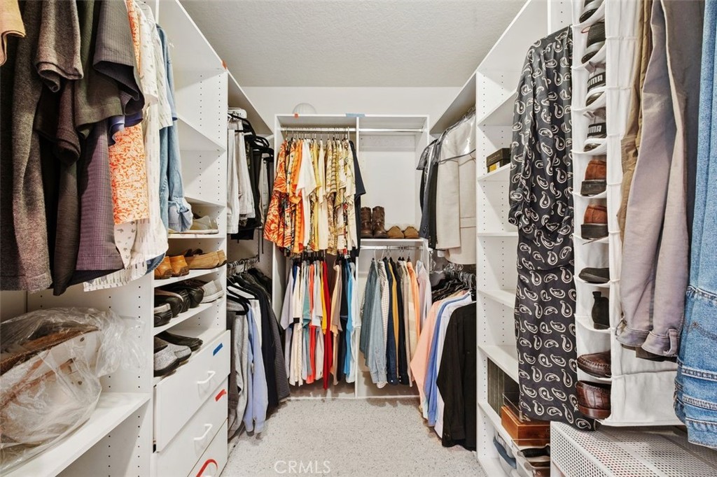 32 Colonial Irvine, CA 92620 - Photo 21 of 33 a view of walk in closet with clothes and shoes