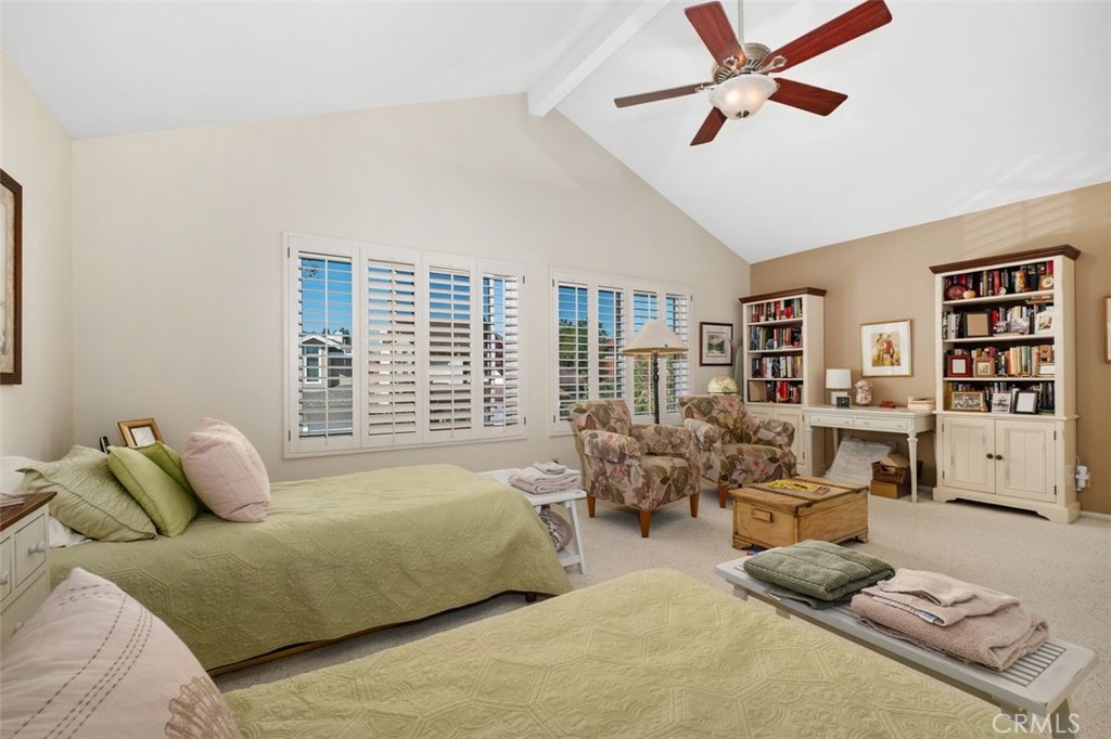 32 Colonial Irvine, CA 92620 - Photo 24 of 33 a bedroom with furniture and a book shelf