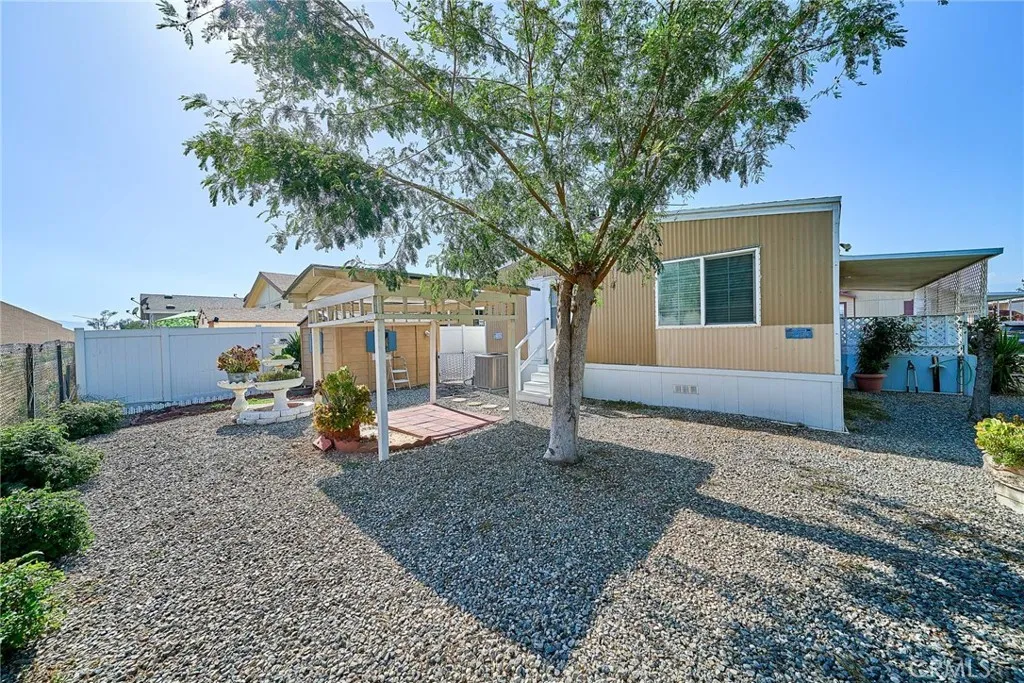 4000 Pierce Street, Unit 168 Riverside, CA 92505 - Photo 25 of 34 a front view of a house with garden