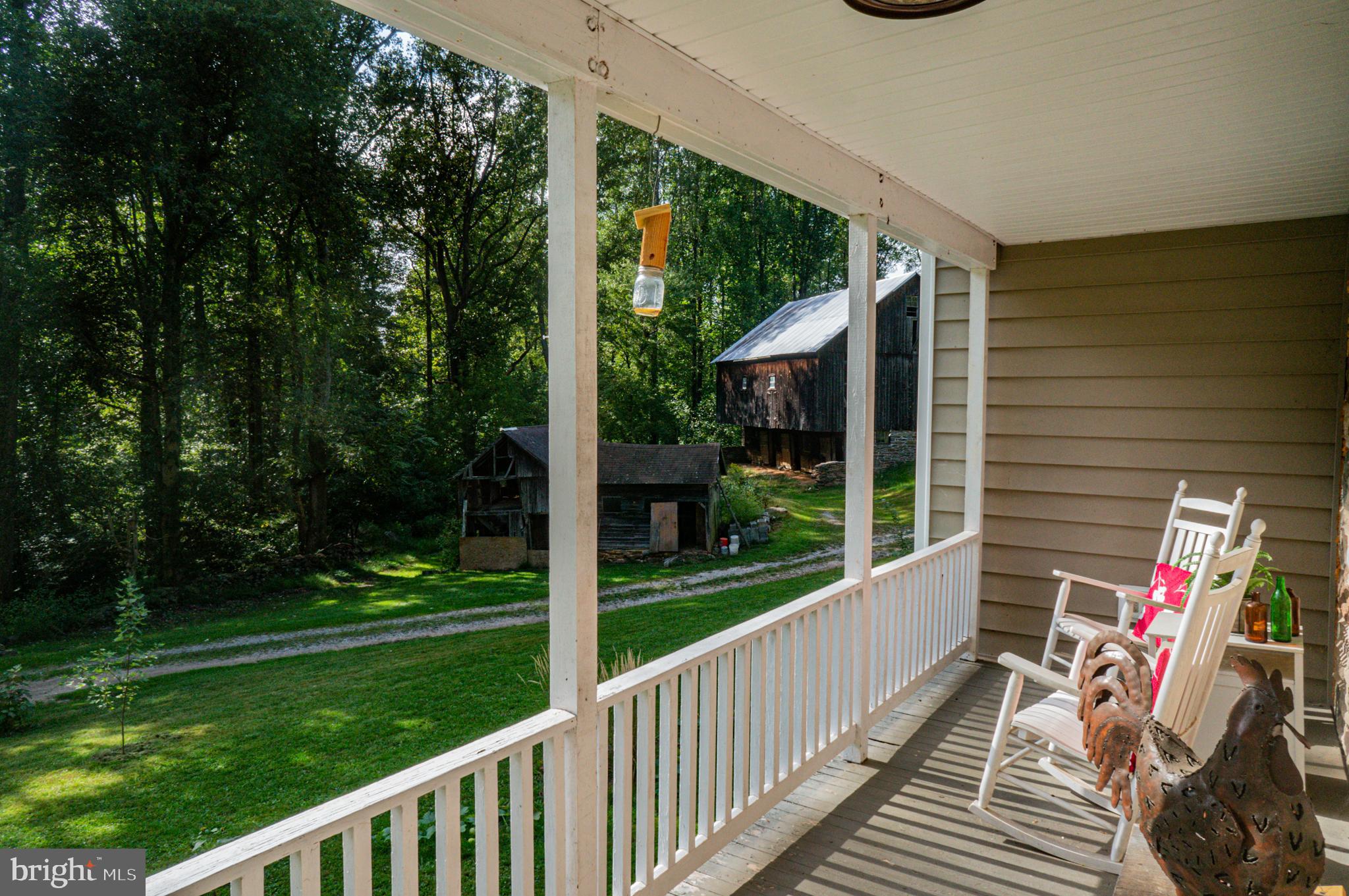 988 Kratz Road Glen Rock, PA 17327 - Photo 25 of 97 a view of a balcony with chairs and floor to ceiling window