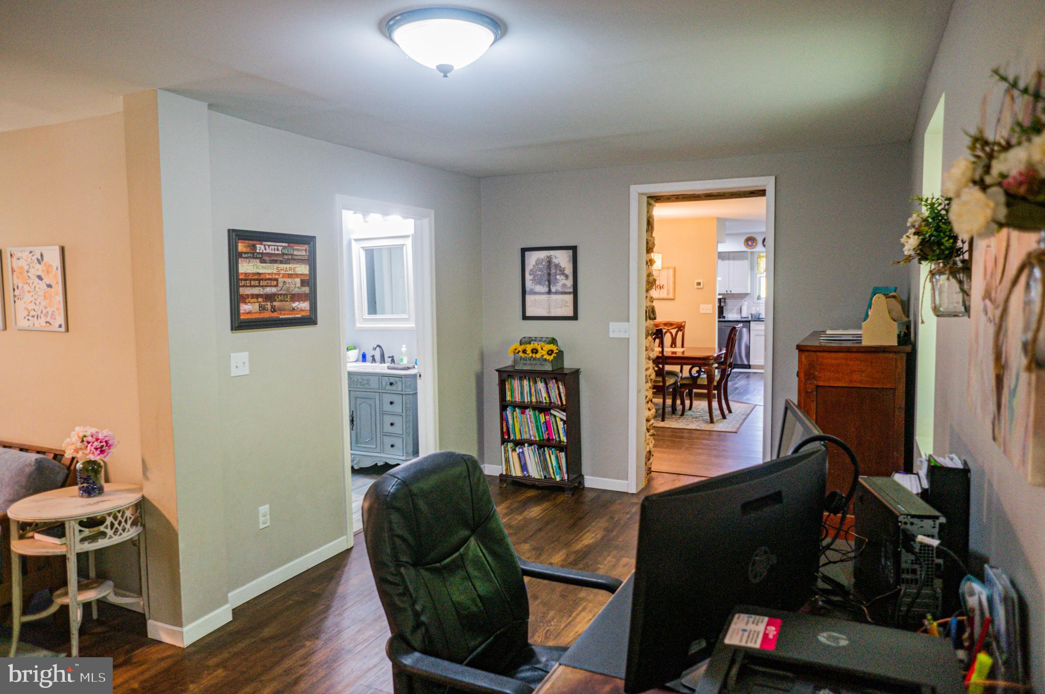 988 Kratz Road Glen Rock, PA 17327 - Photo 31 of 97 a living room with furniture a flat screen tv and a window