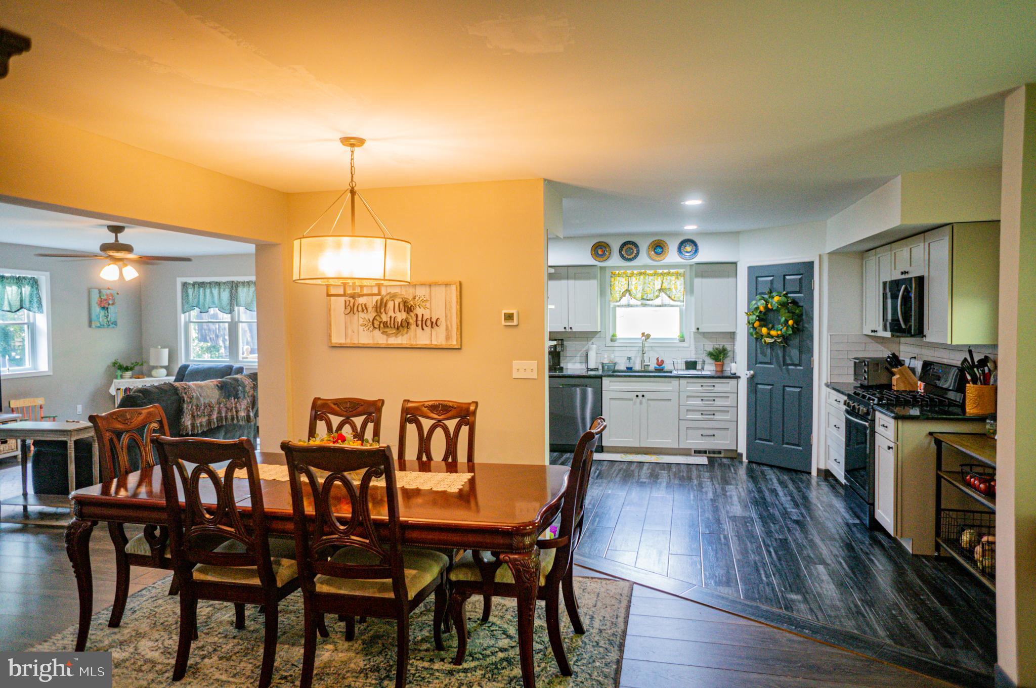 988 Kratz Road Glen Rock, PA 17327 - Photo 33 of 97 a view of a dining room with furniture and wooden floor