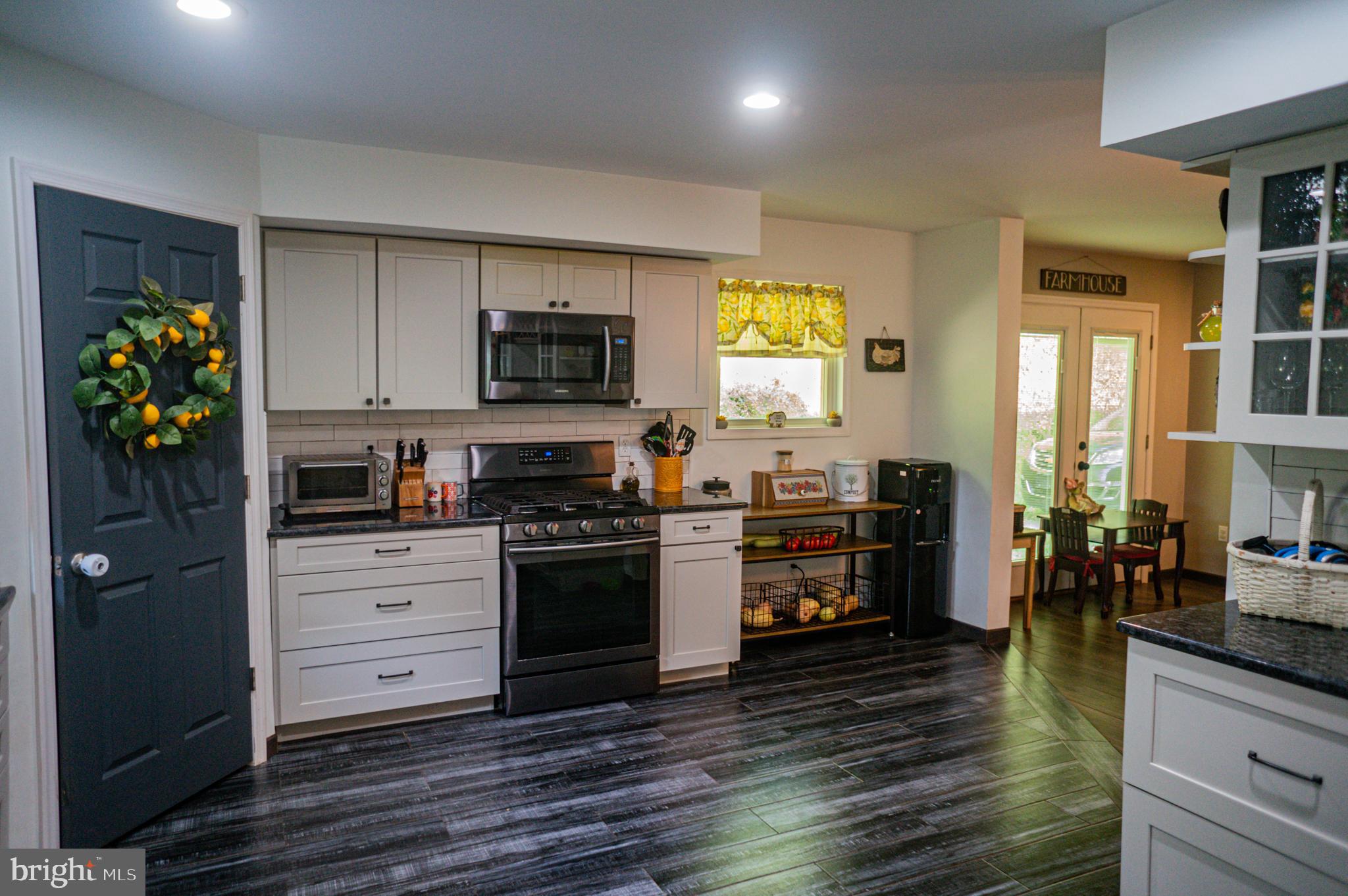 988 Kratz Road Glen Rock, PA 17327 - Photo 40 of 97 a kitchen with a stove and a refrigerator