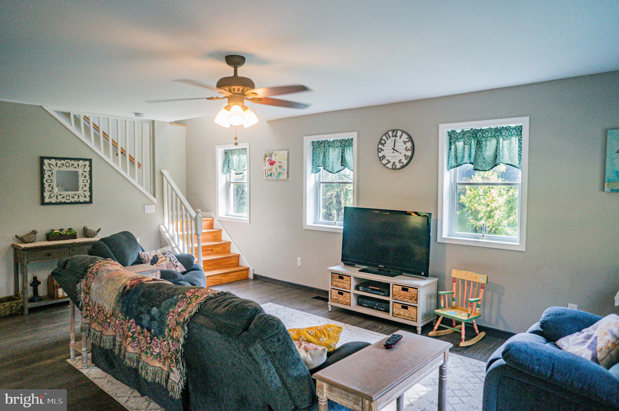 988 Kratz Road Glen Rock, PA 17327 - Photo 42 of 97 a living room with furniture and a flat screen tv