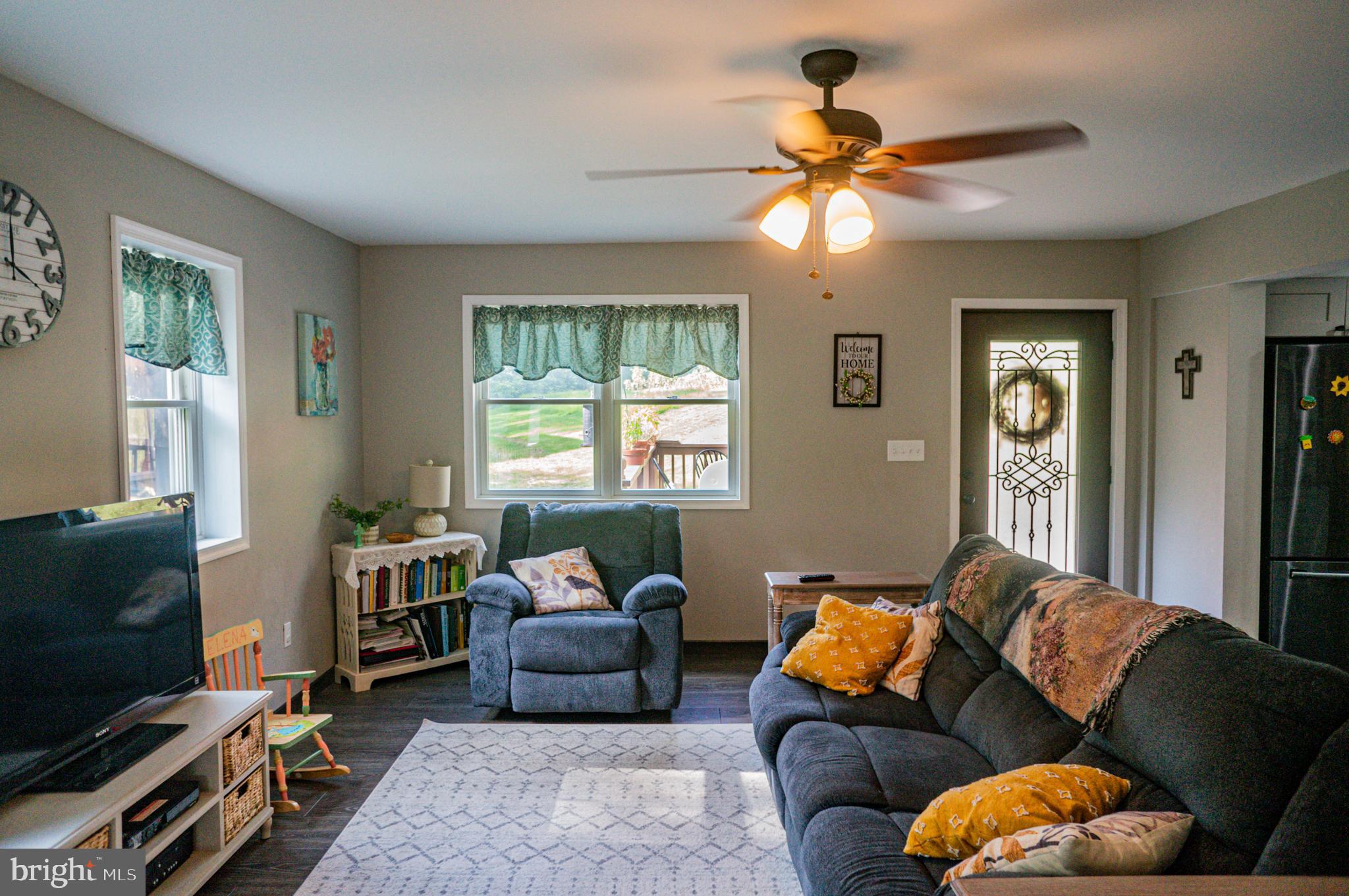 988 Kratz Road Glen Rock, PA 17327 - Photo 44 of 97 a living room with furniture and a flat screen tv