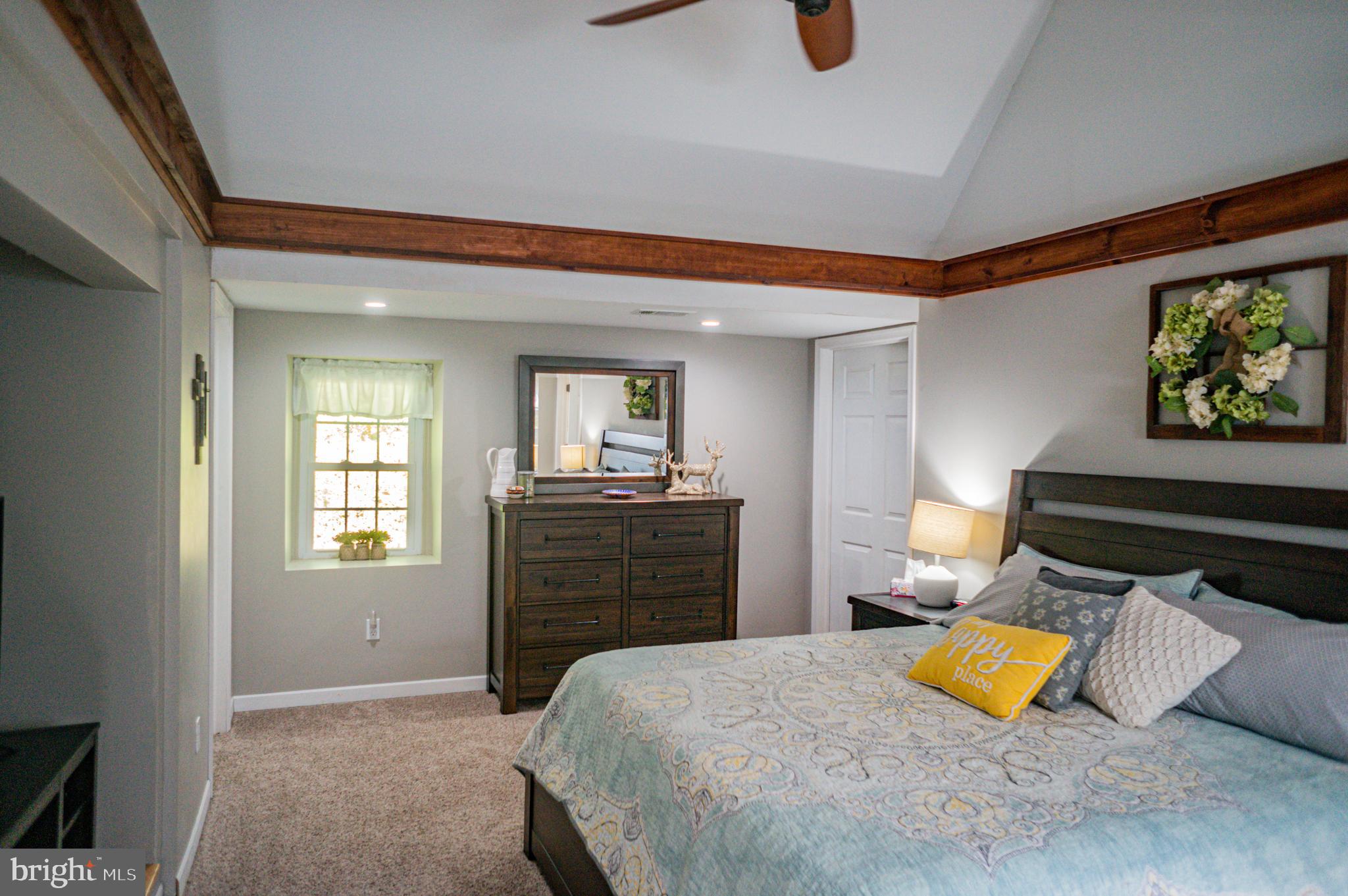 988 Kratz Road Glen Rock, PA 17327 - Photo 50 of 97 a bedroom with a bed and wooden floor