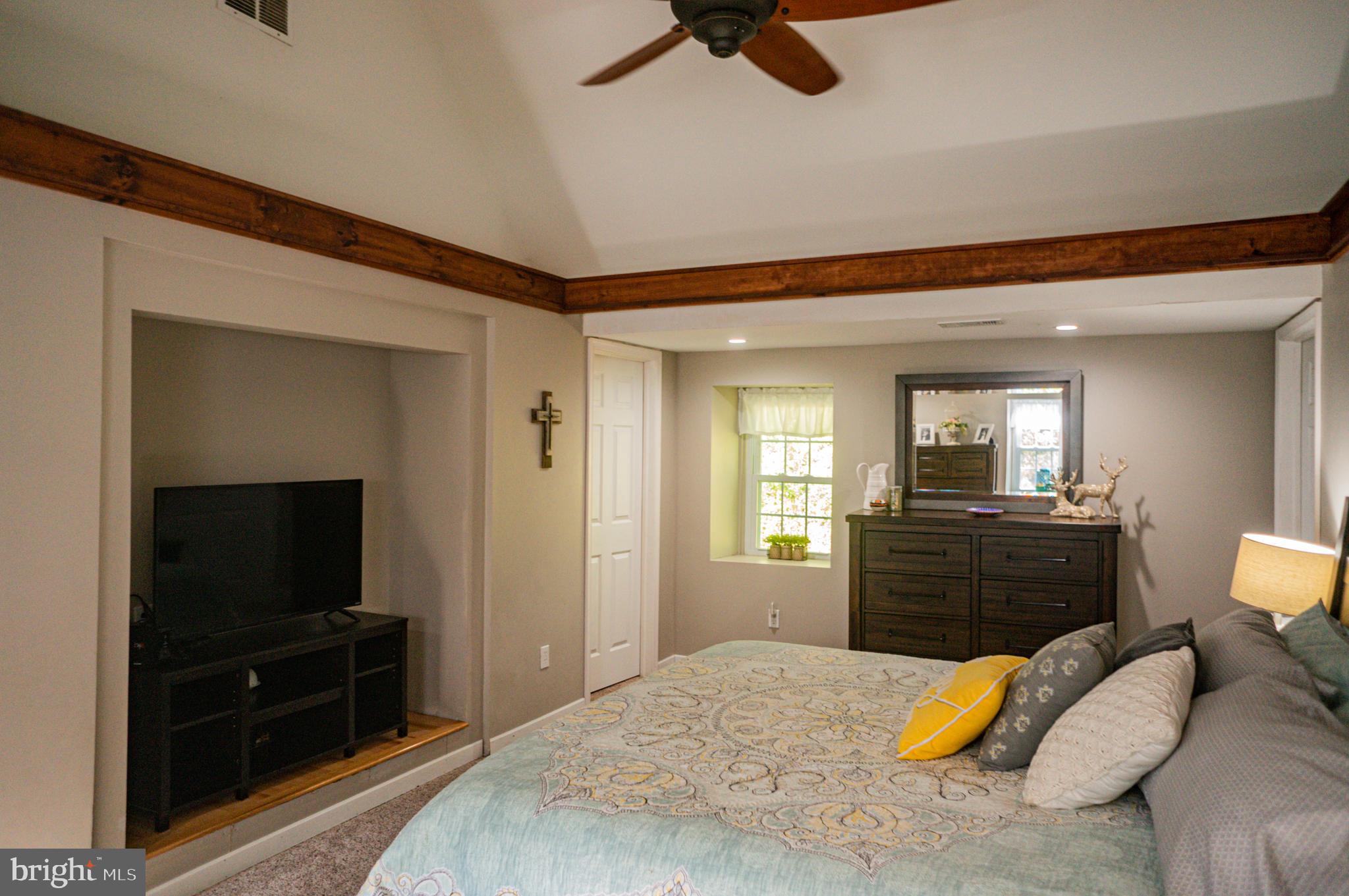 988 Kratz Road Glen Rock, PA 17327 - Photo 51 of 97 a bedroom with a bed and a television in it