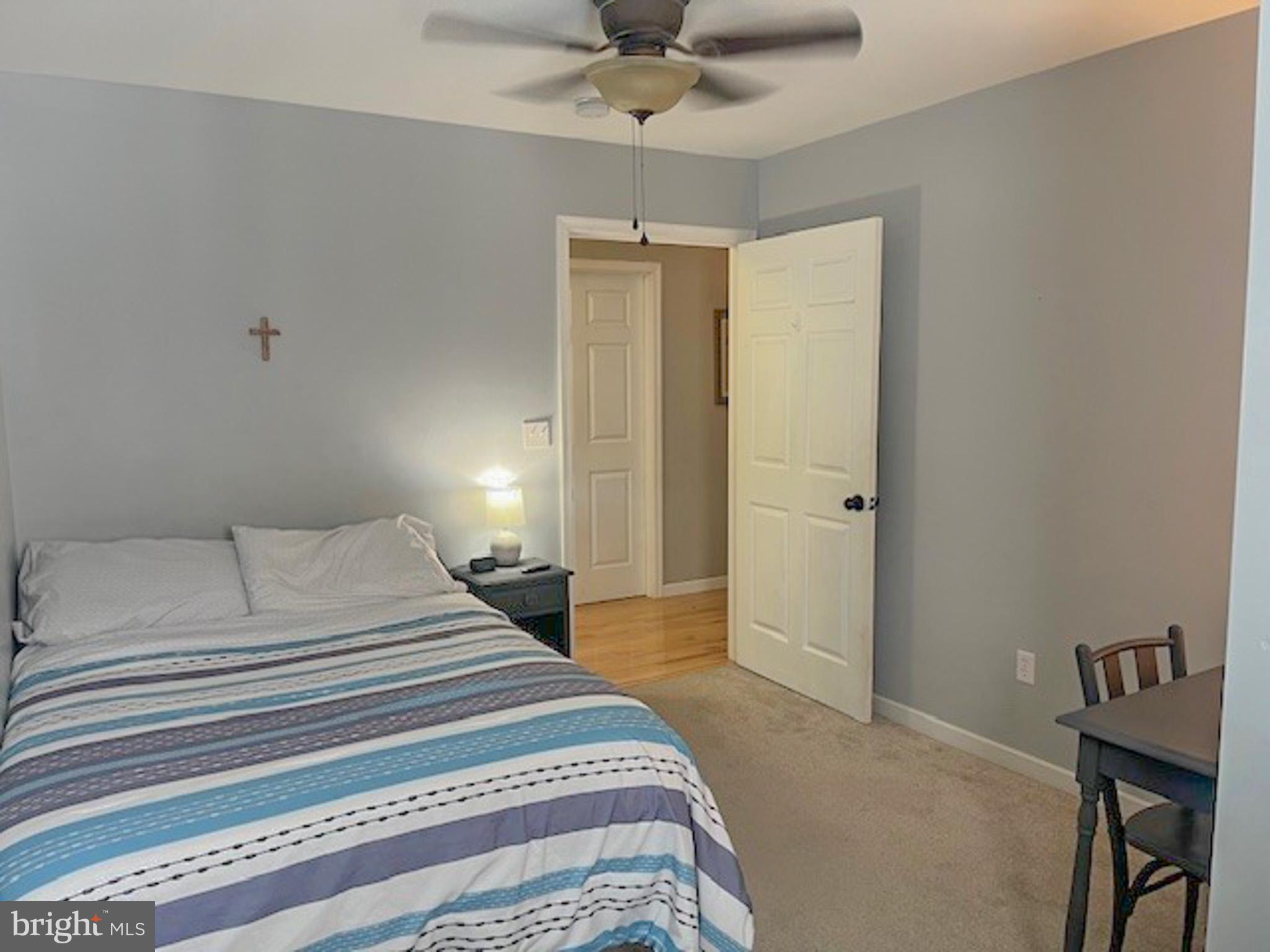 988 Kratz Road Glen Rock, PA 17327 - Photo 58 of 97 a bedroom with a bed and a chandelier