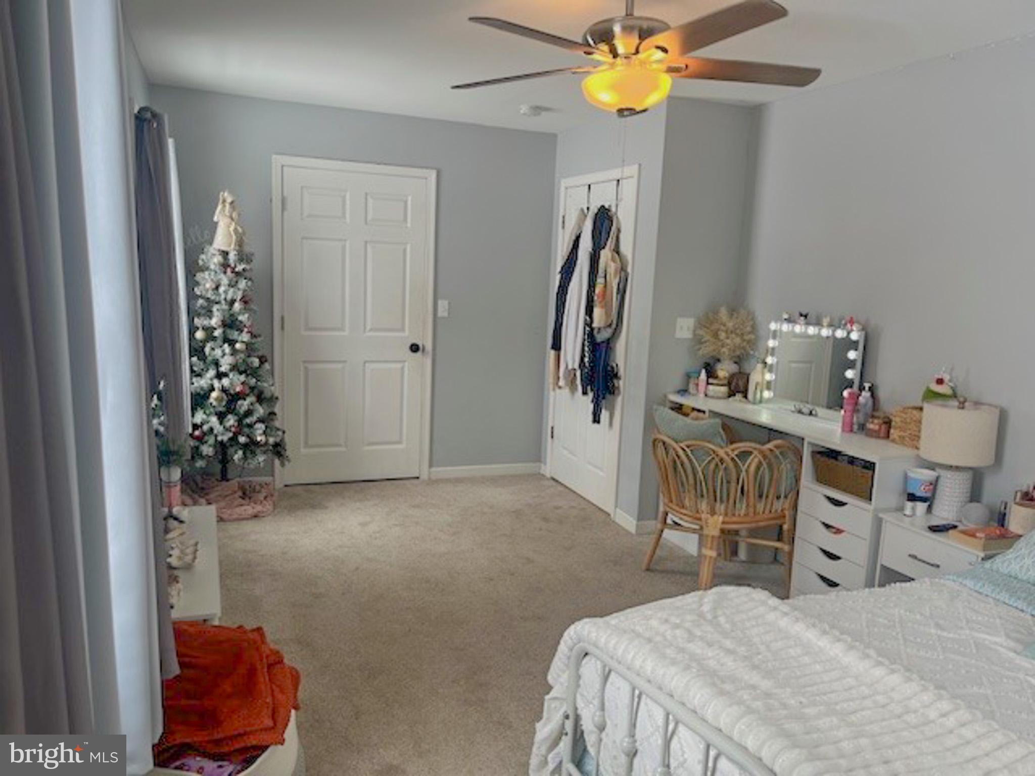 988 Kratz Road Glen Rock, PA 17327 - Photo 61 of 97 a bedroom with a bed and a chandelier