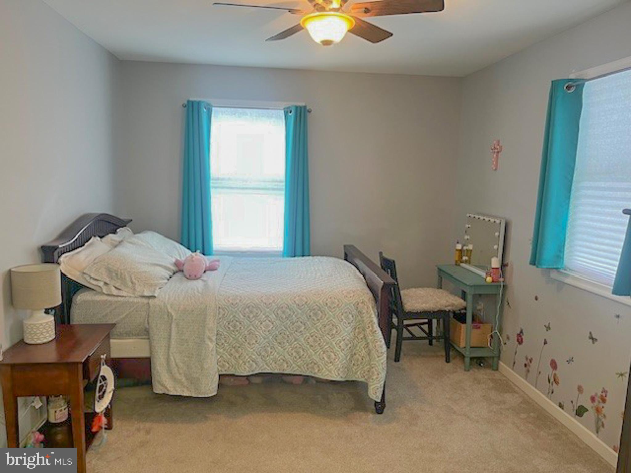 988 Kratz Road Glen Rock, PA 17327 - Photo 63 of 97 a bedroom with a bed and a chandelier fan