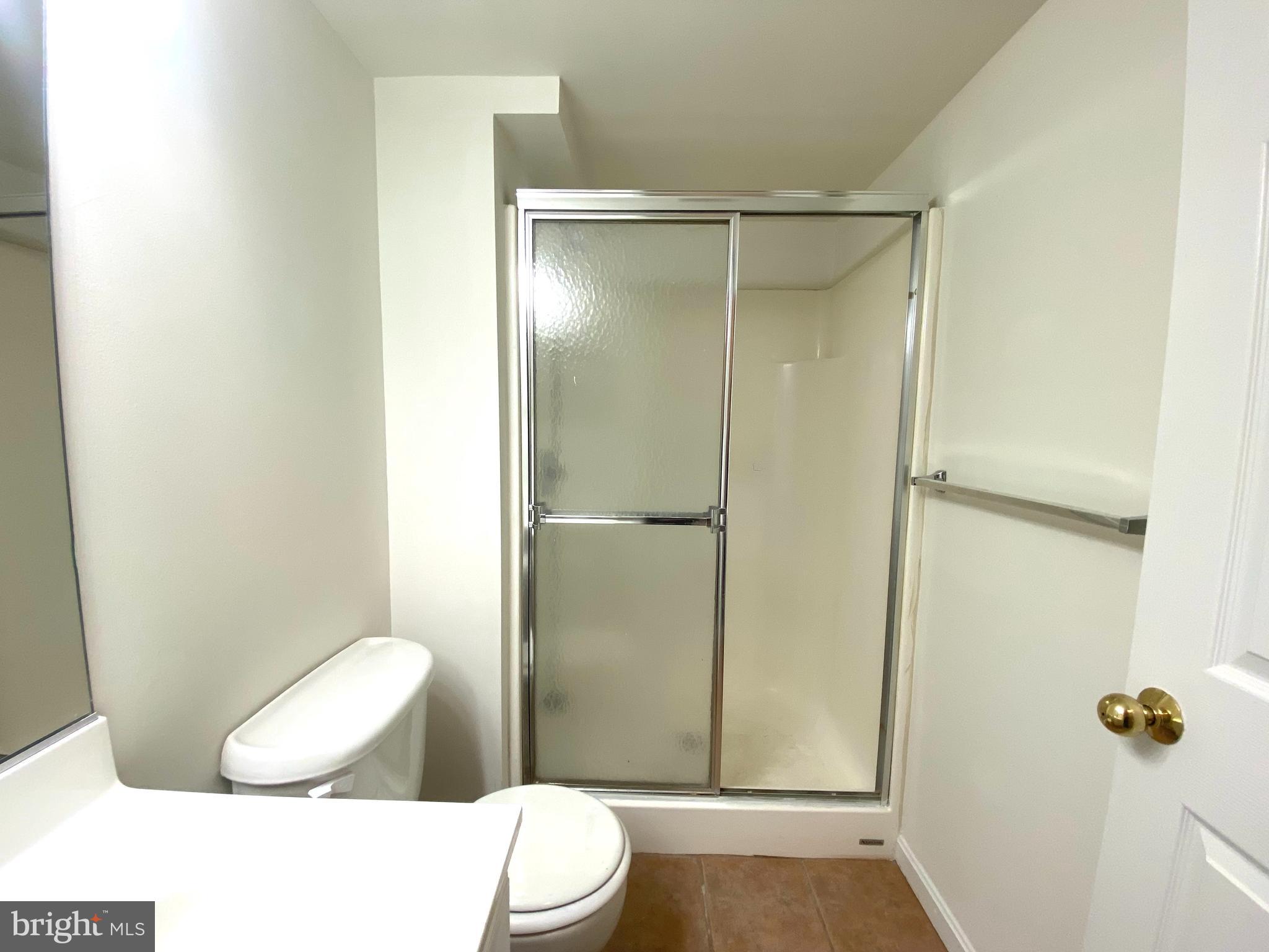 17324 Sligo Loop Dumfries, VA 22026 - Photo 29 of 39 a bathroom with a toilet and a shower