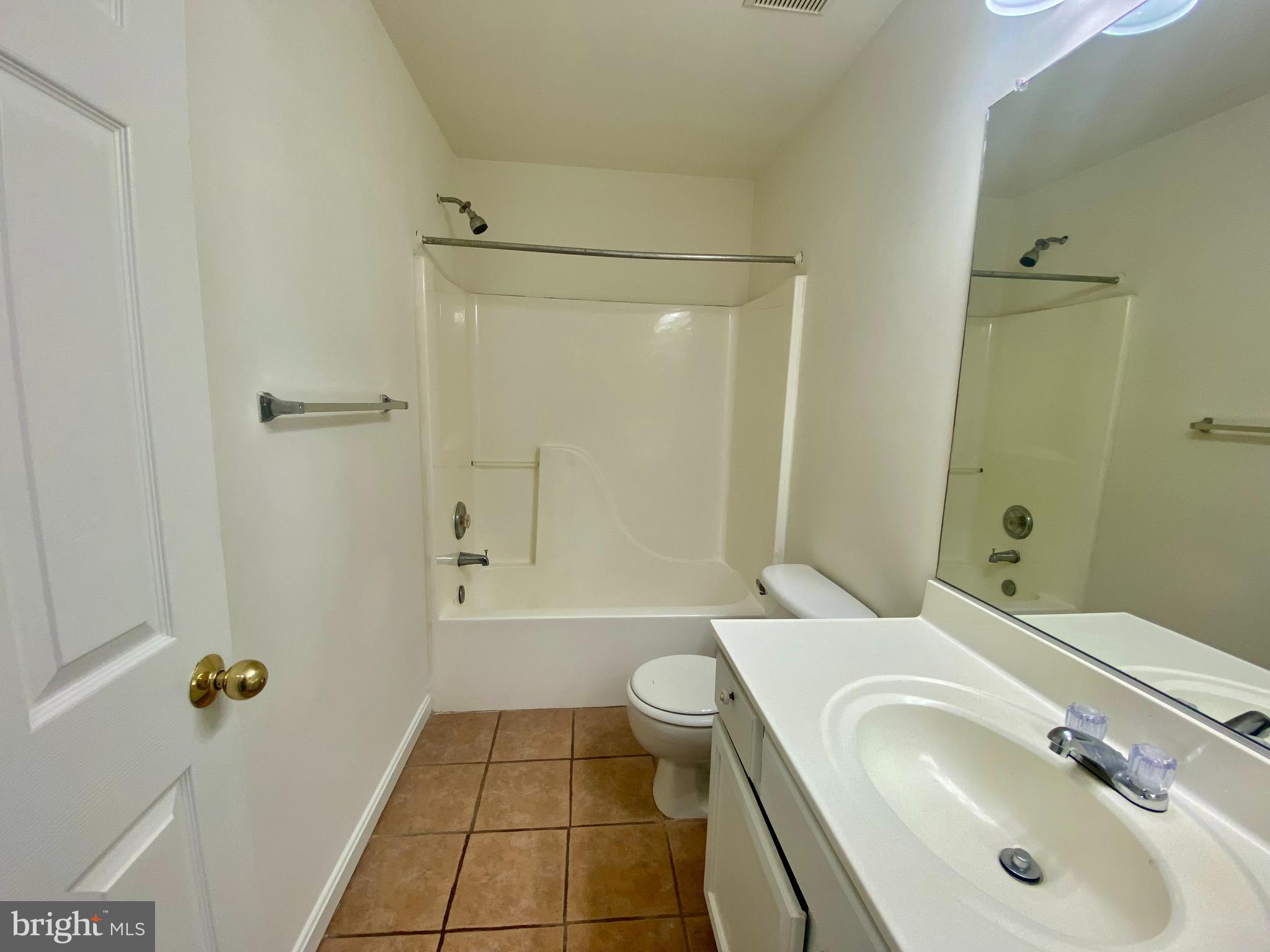 17324 Sligo Loop Dumfries, VA 22026 - Photo 31 of 39 a bathroom with a sink a toilet and shower