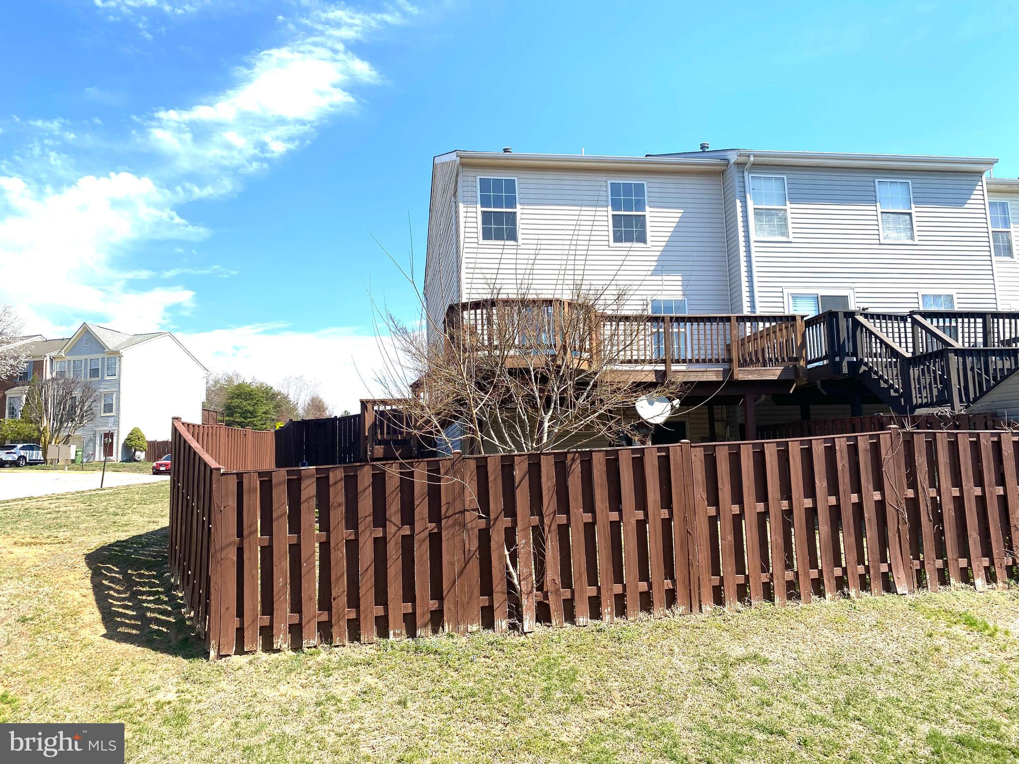 17324 Sligo Loop Dumfries, VA 22026 - Photo 39 of 39 a view of a house with wooden fence