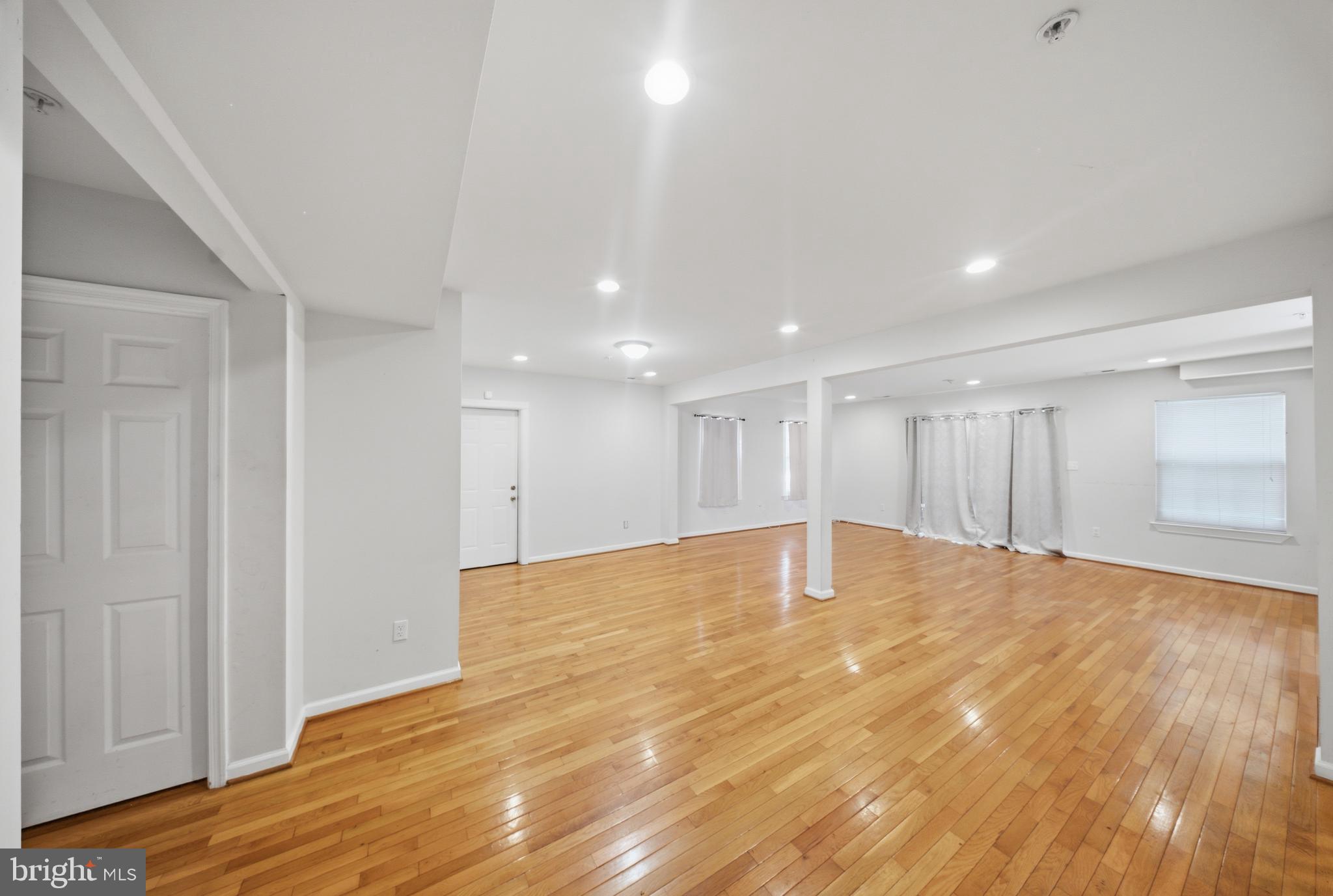 7611 Temple Hill Road Temple Hills, MD 20748 - Photo 4 of 25 a view of an empty room with wooden floor