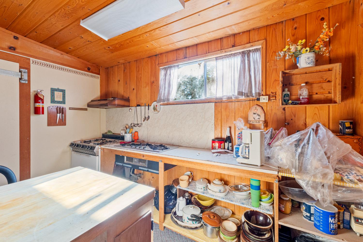 5983 Sly Park Road Placerville, CA 95667 - Photo 20 of 36 a kitchen with stainless steel appliances a stove a sink and a cabinets