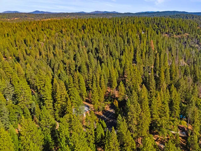 a view of a large body of water with a mountain view