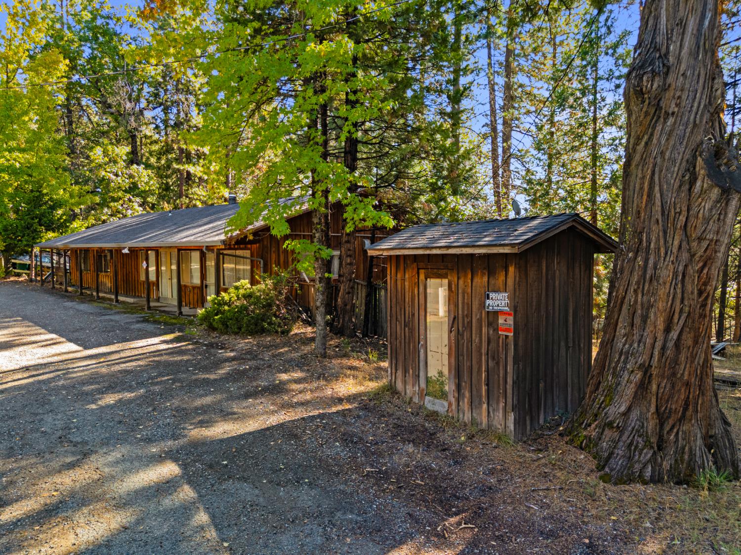 5983 Sly Park Road Placerville, CA 95667 - Photo 6 of 36 a view of a house with a tree and wooden fence