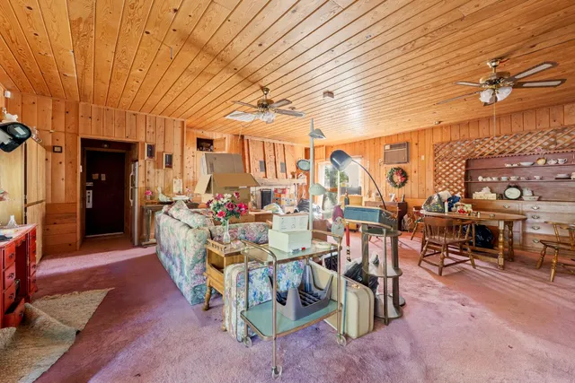 a view of a patio with table and chairs