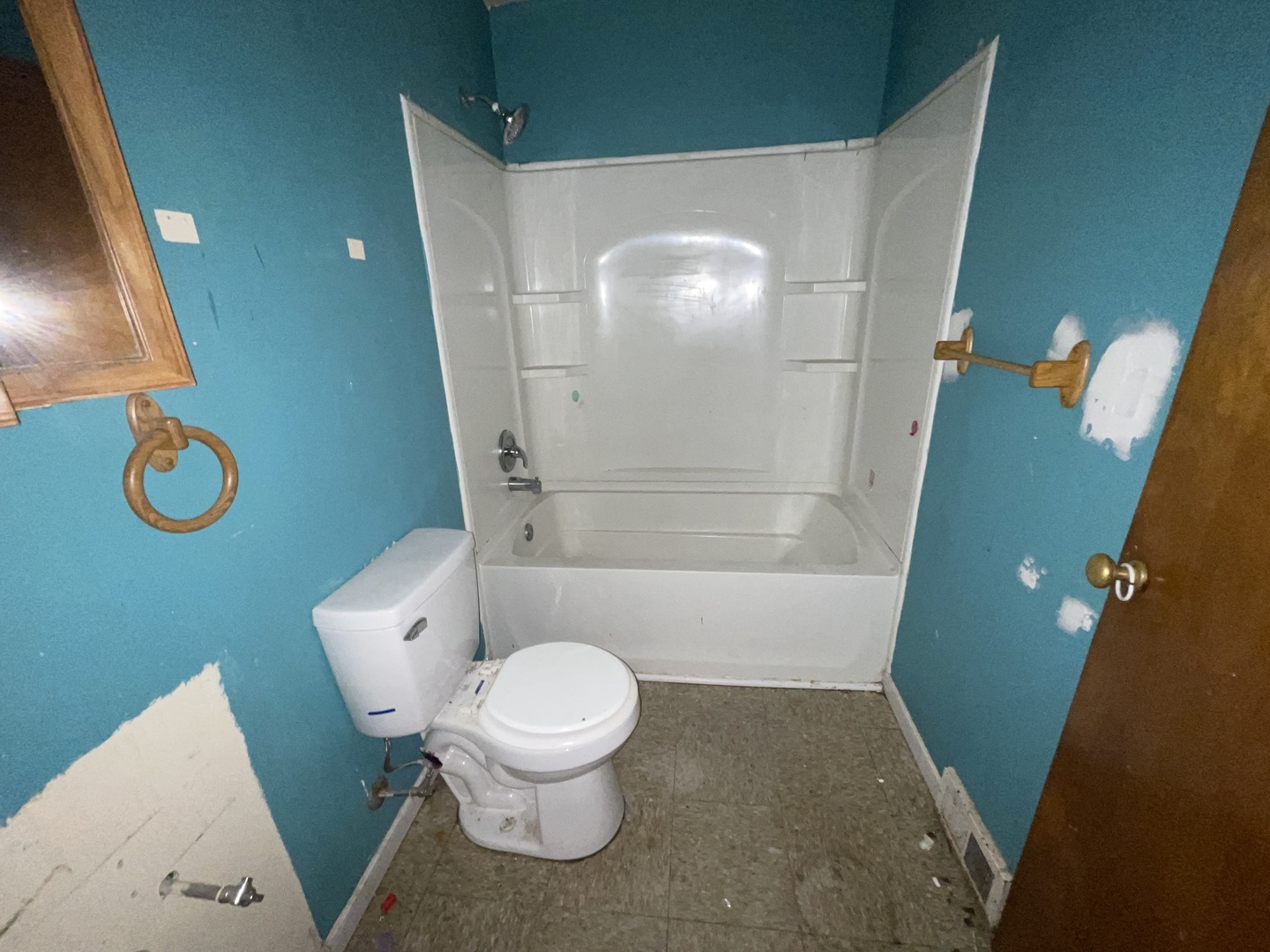 754 South Oakland Avenue Decatur, IL 62522 - Photo 16 of 18 a white toilet sitting next to a bathroom sink and a mirror
