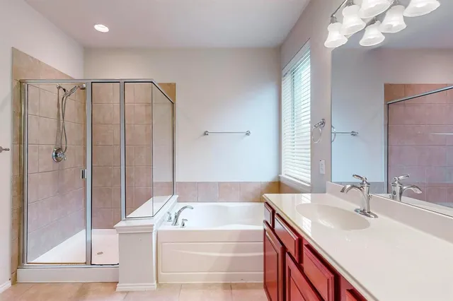 a bathroom with a sink a mirror and a bathtub