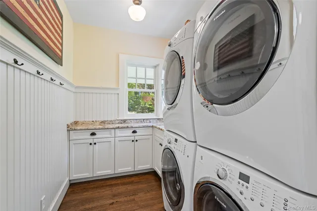 a view of a storage and utility room with washer and dryer