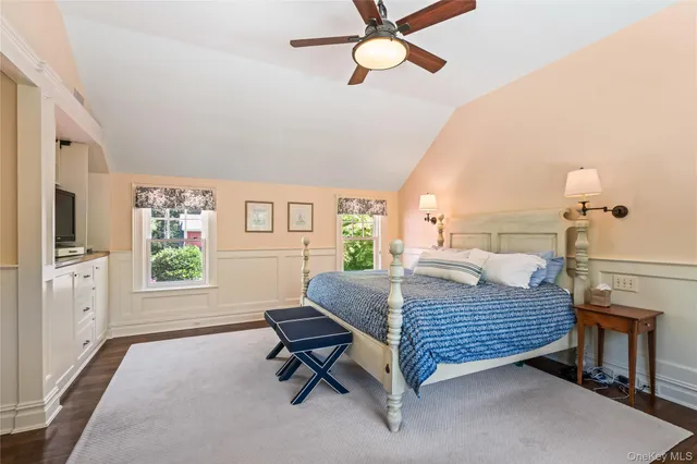 a living room with a bed furniture and a window