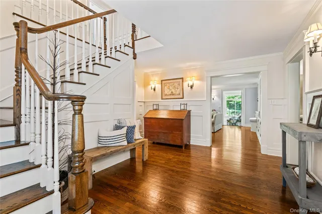 a livingroom with wooden floor and furniture