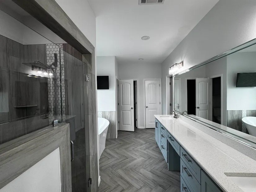 2295 Diamond D Lane Beaumont, TX 77713 - Photo 12 of 40 a large bathroom with a double vanity sink and a mirror